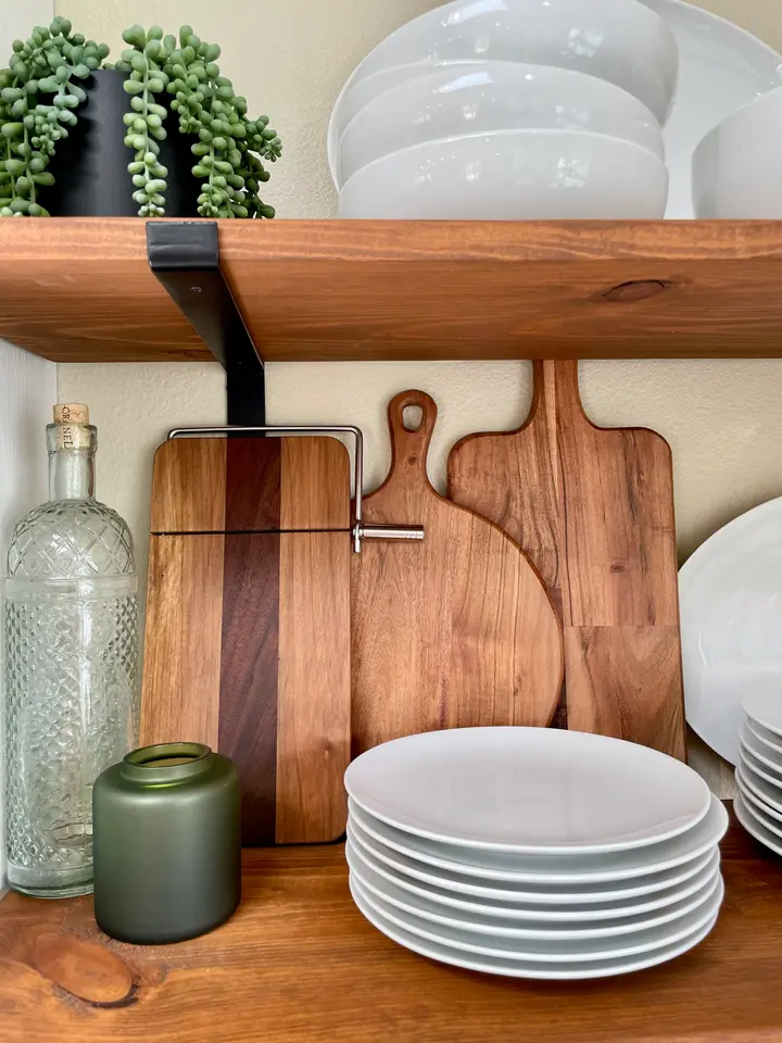 Handmade wooden serving boards displayed in a kitchen